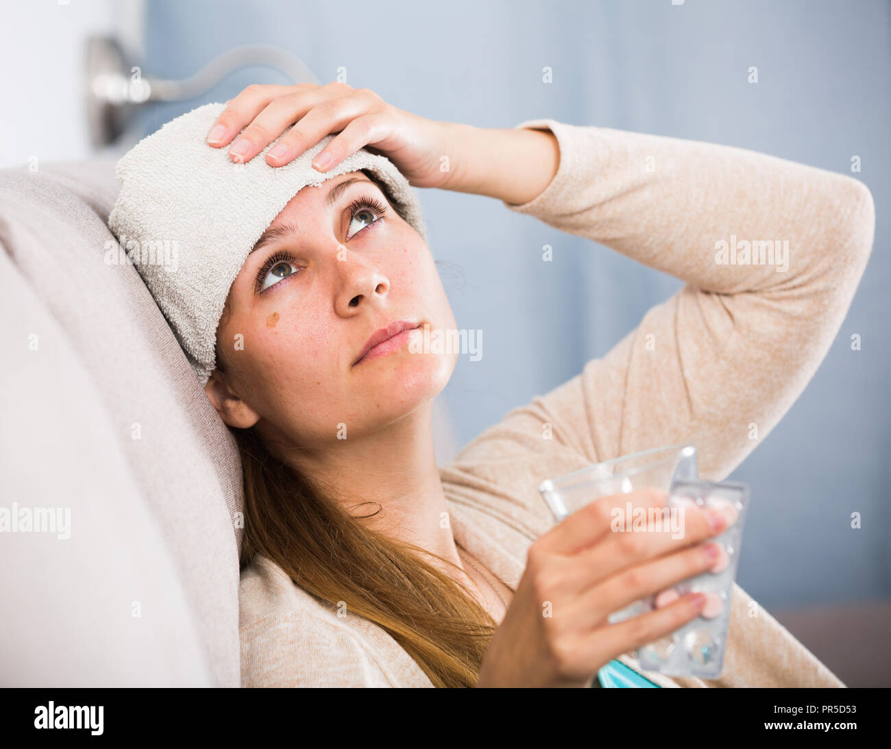 Cold Trying Young girl with cold trying to get well at home Stock Photo - Alamy