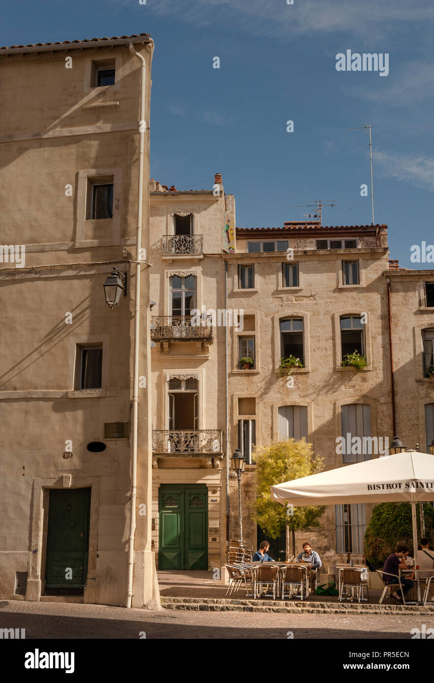 A typical inner city square full of flair is the Place Sainte-Anne in Montpellier with the bistro Sainte-Anne. Stock Photo