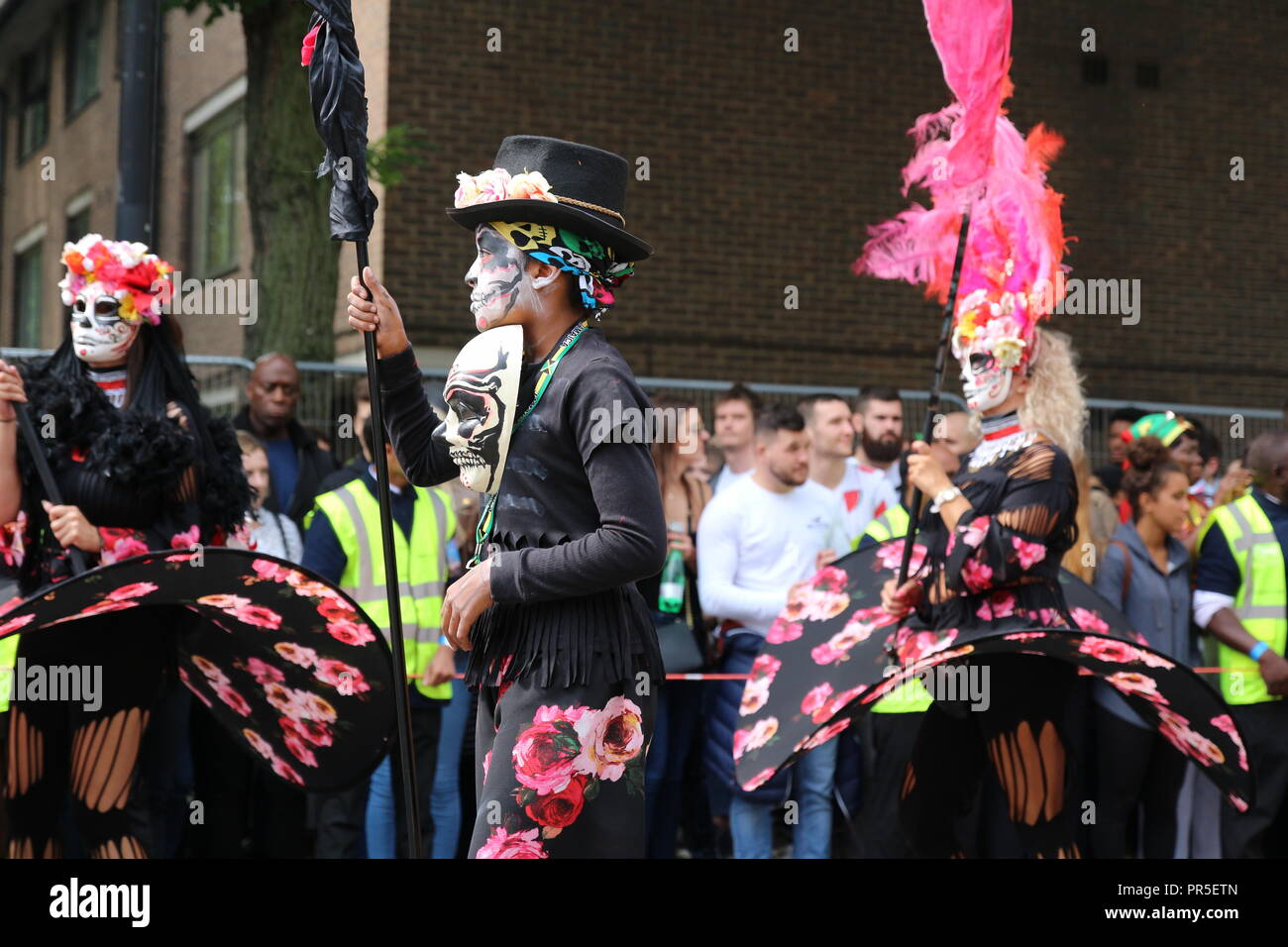 London, UK - August 27, 2018:  Notting Hill Carnival Participants wearing sugar skull makeup during Dia de los Muertos Stock Photo