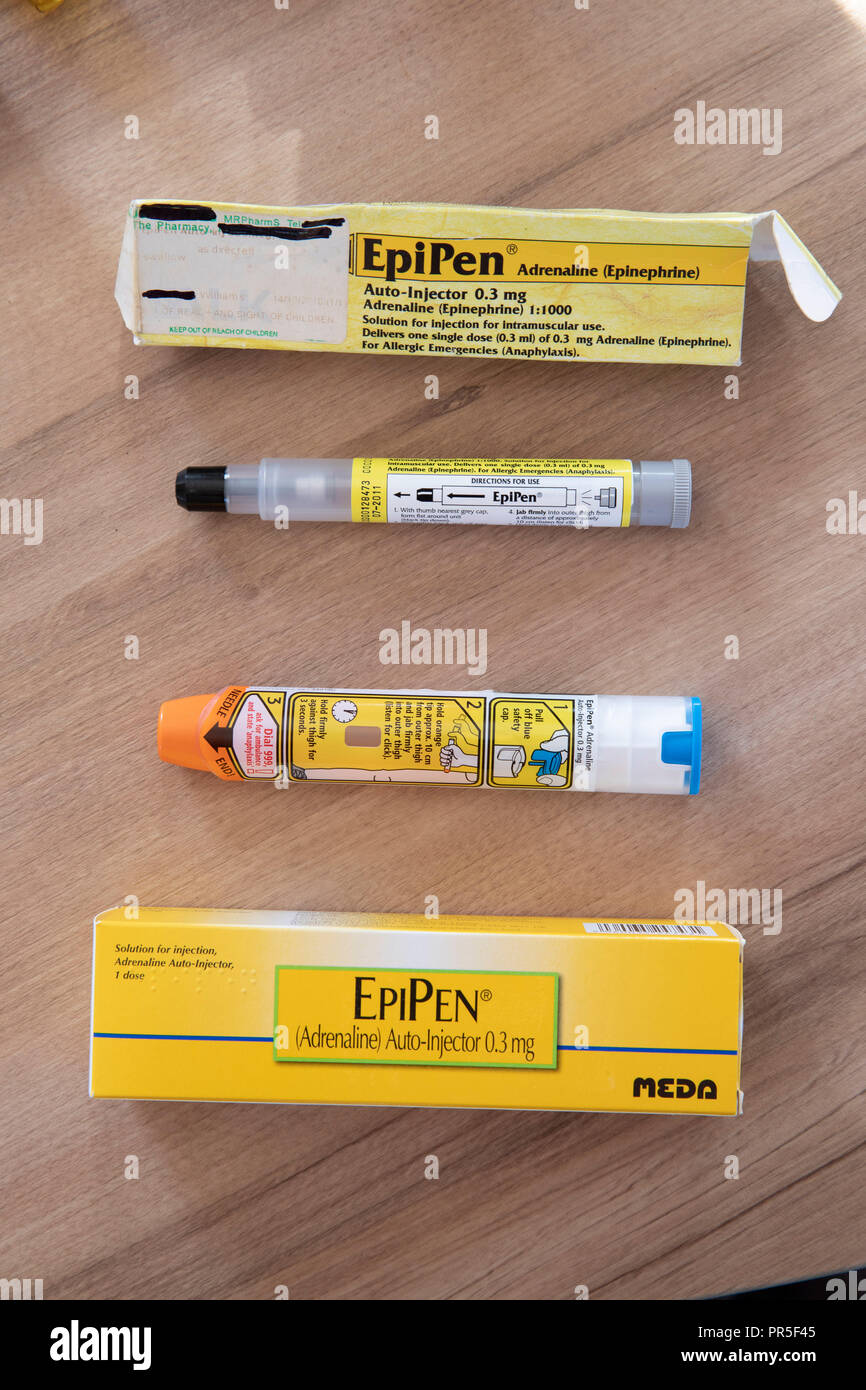 EpiPen autoejectors used to inject adrenaline into a victim of anaphalaxis. An older black tipped injector next to a newer orange tipped EpiPen   Cred Stock Photo