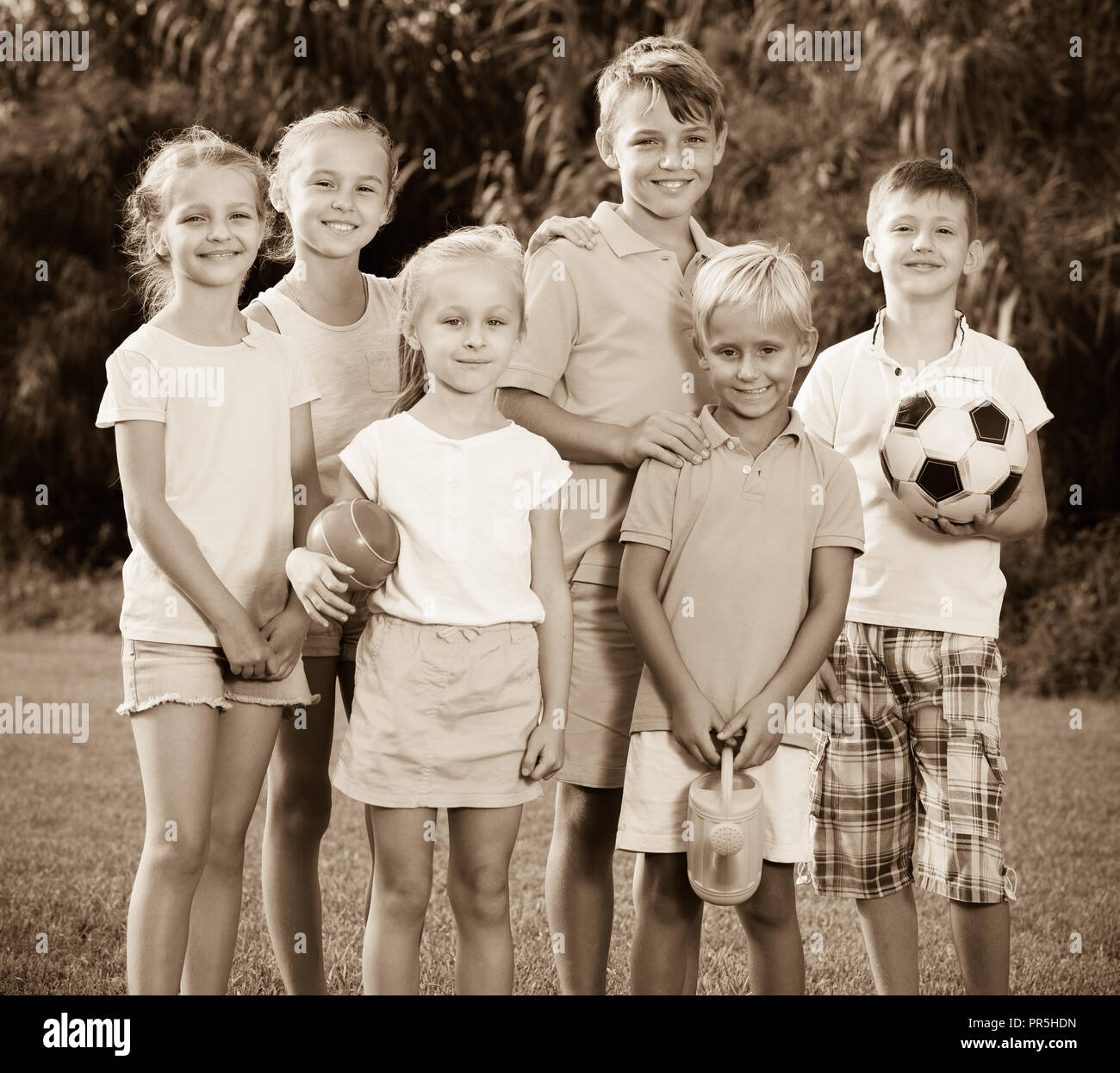Children holding toys school hi-res stock photography and images - Alamy