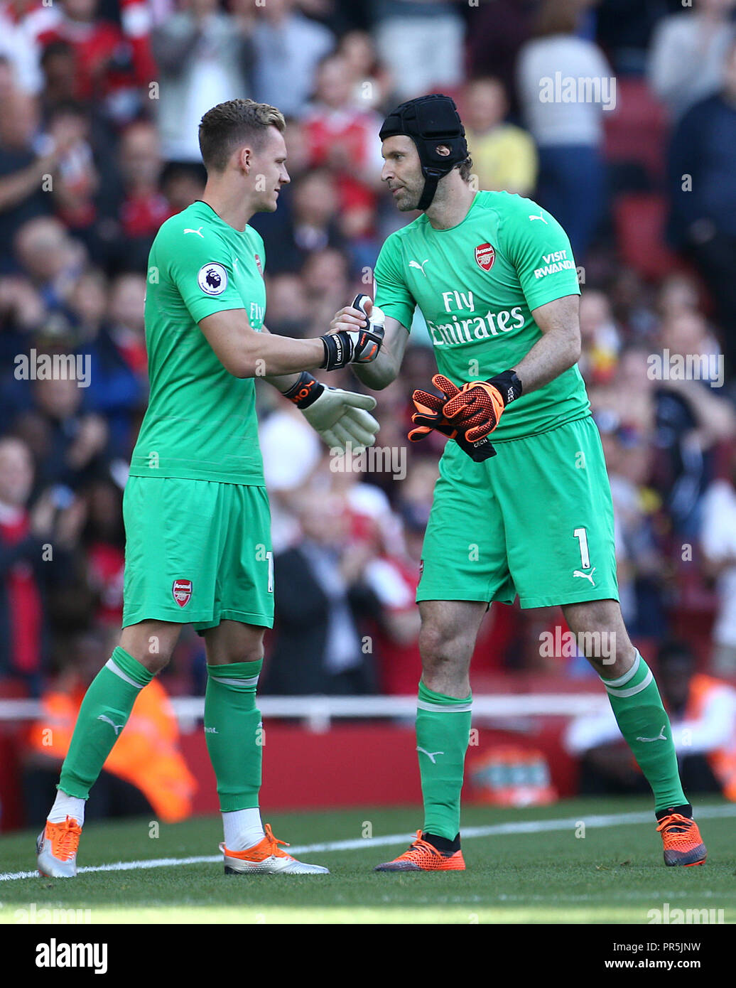 Arsenal goalkeeper Petr Cech (right) is replaced by team-mate Bernd Leno  after picking up an injury during the Premier League match at the Emirates  Stadium, London Stock Photo - Alamy