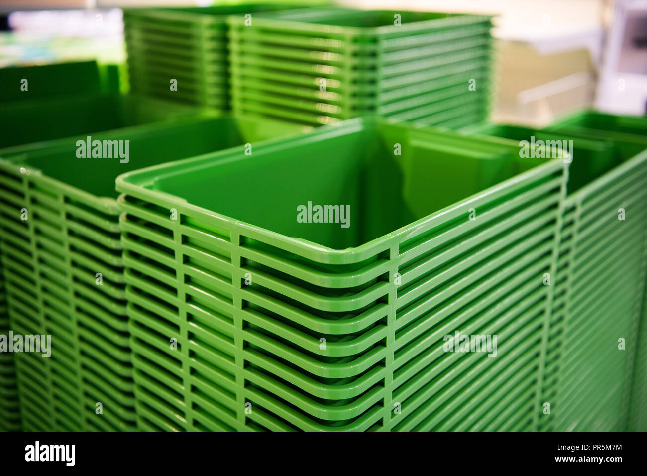 Green plastic home containers tower at store Stock Photo Alamy