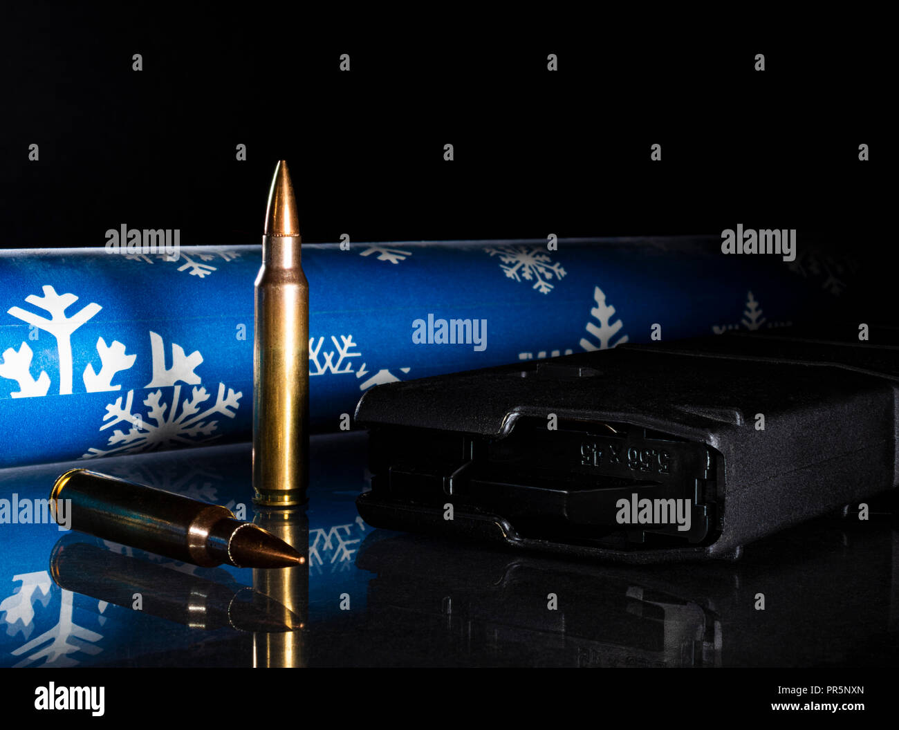 Holiday gift of a magazine and ammunition for a gun owner Stock Photo