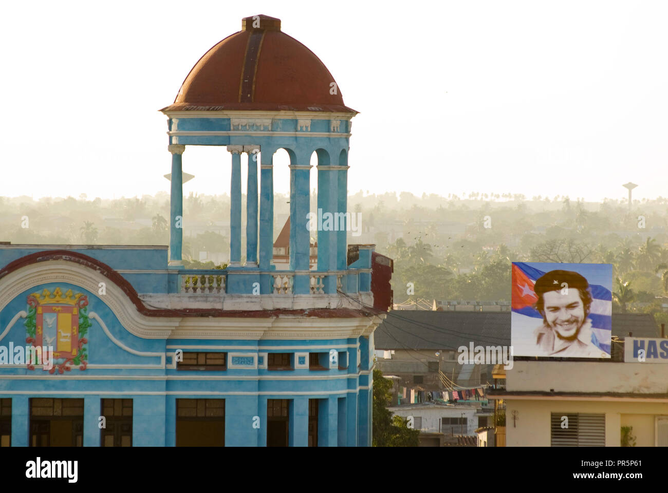 Flag of Che Guevara on top of Camaguey's city centre oldest buildings in Cuba Stock Photo