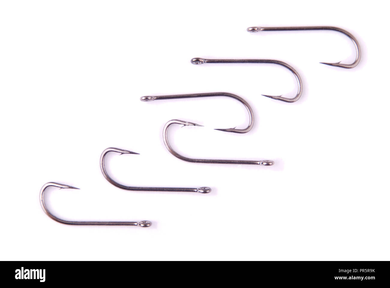 Stainless steel fishing hooks isolated on white Stock Photo Alamy