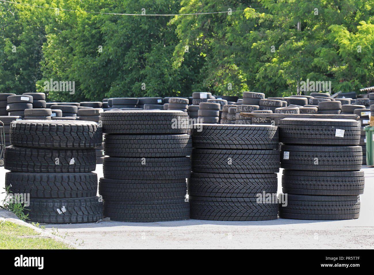 Outside storage warehouse with new and second hand car tires Stock Photo
