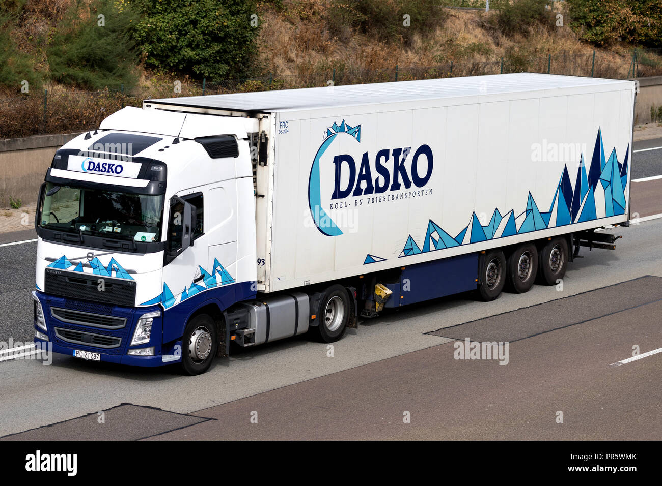Dasko truck on motorway. Dasko is a family company that was established in 1913 and is specialized in refrigerated transport. Stock Photo