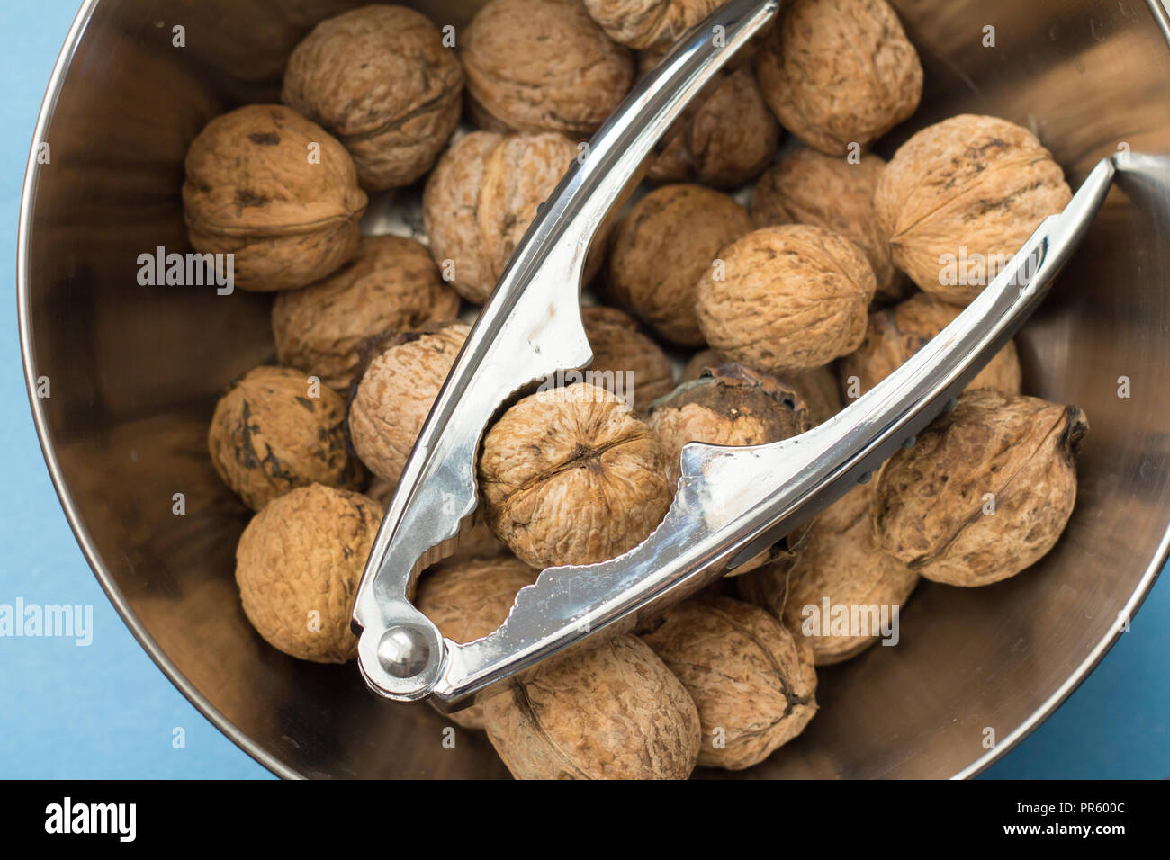 walnuts and nut cracker Stock Photo