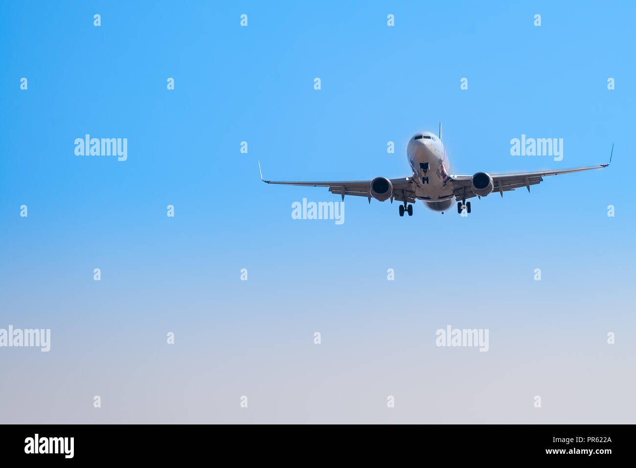 Close up view of an aircraft approaching the airport to land Stock Photo