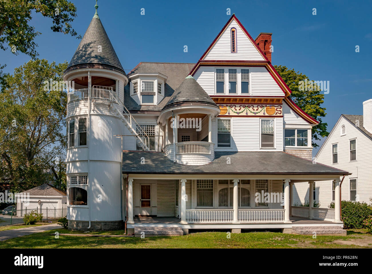 White Wooden house with turret and grey slate roof and front porch, Kay St ,Newport Rhode Island Stock Photo