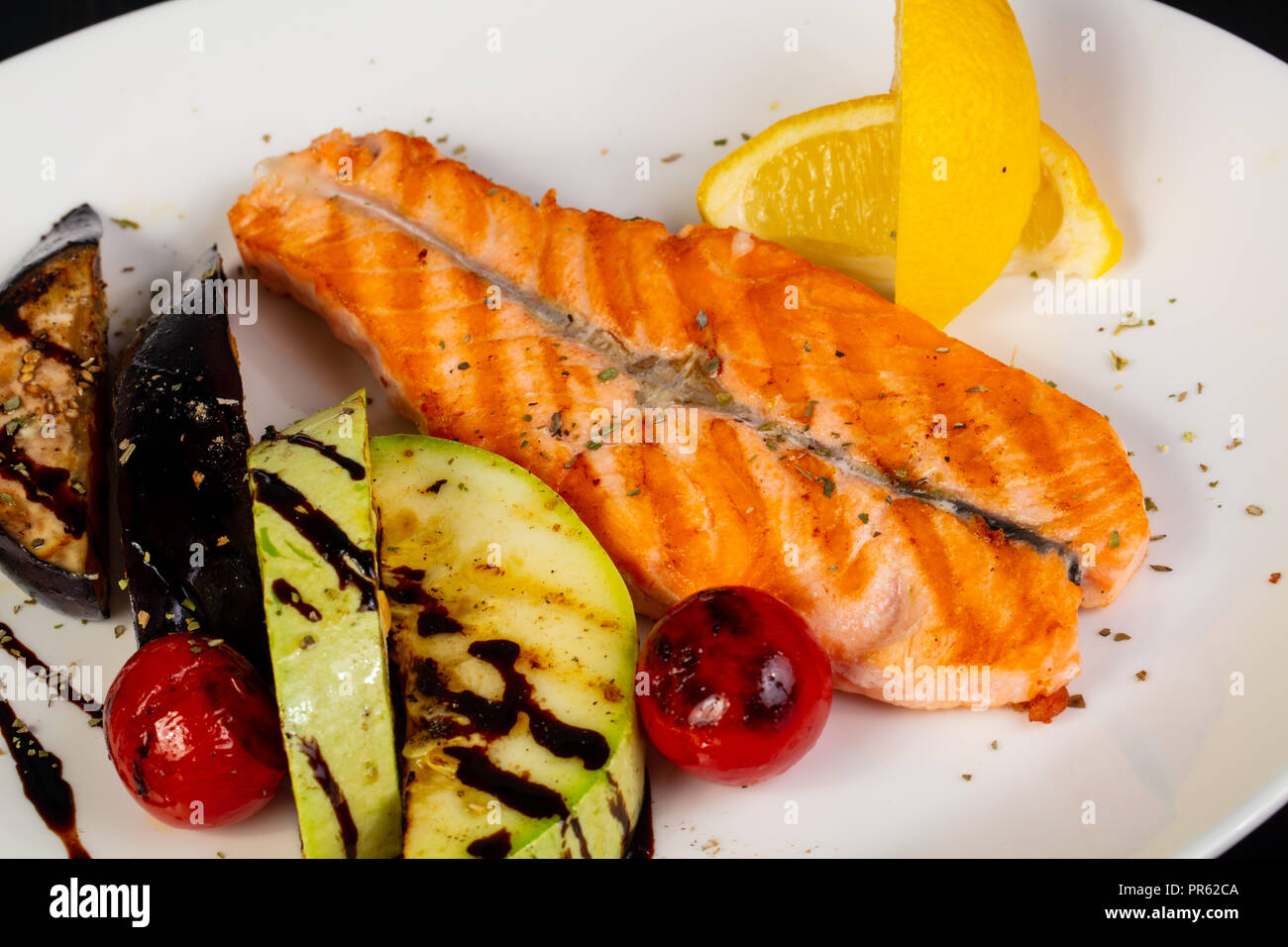 Grilled salmon steak with vegetables Stock Photo - Alamy
