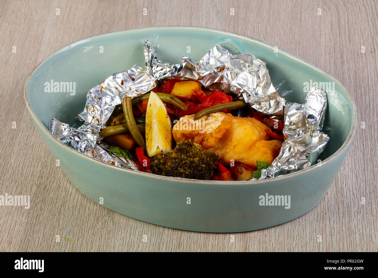 Steamed cod fish with vegetables Stock Photo - Alamy