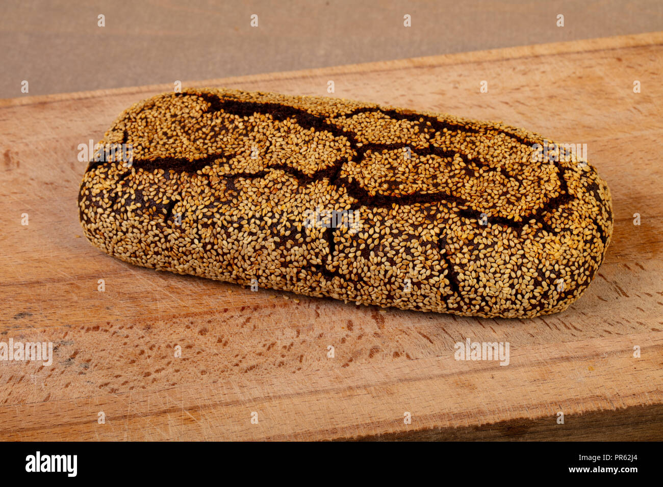 Homemade tasty bread over wooden background Stock Photo - Alamy