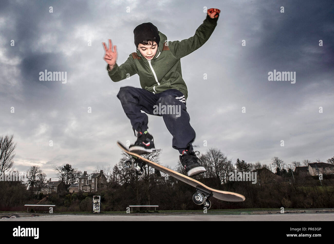 Young boy skateboarding Stock Photo