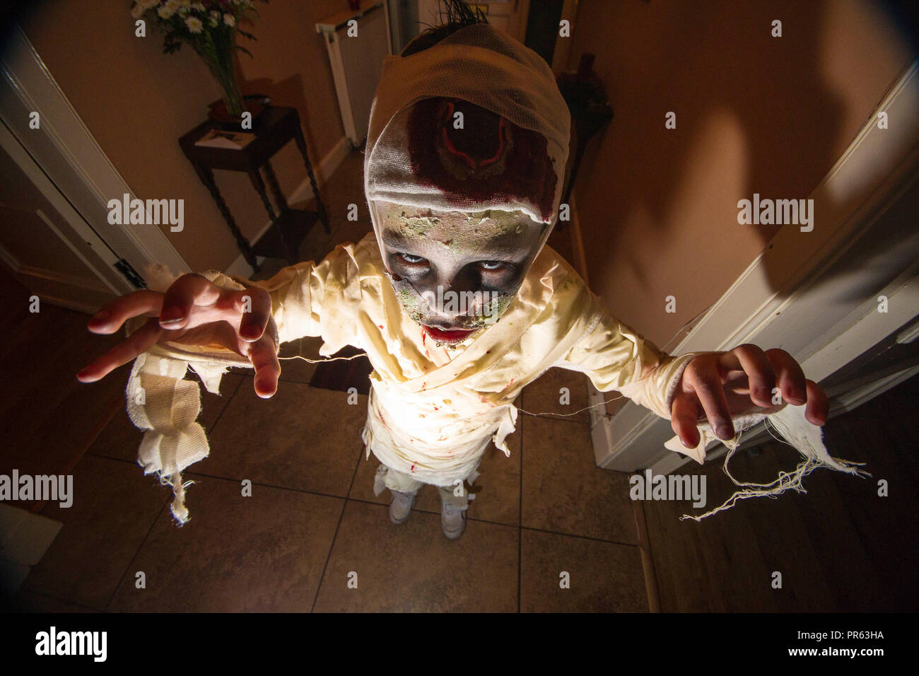 Boy dressed as Mummy for trick or treat Stock Photo