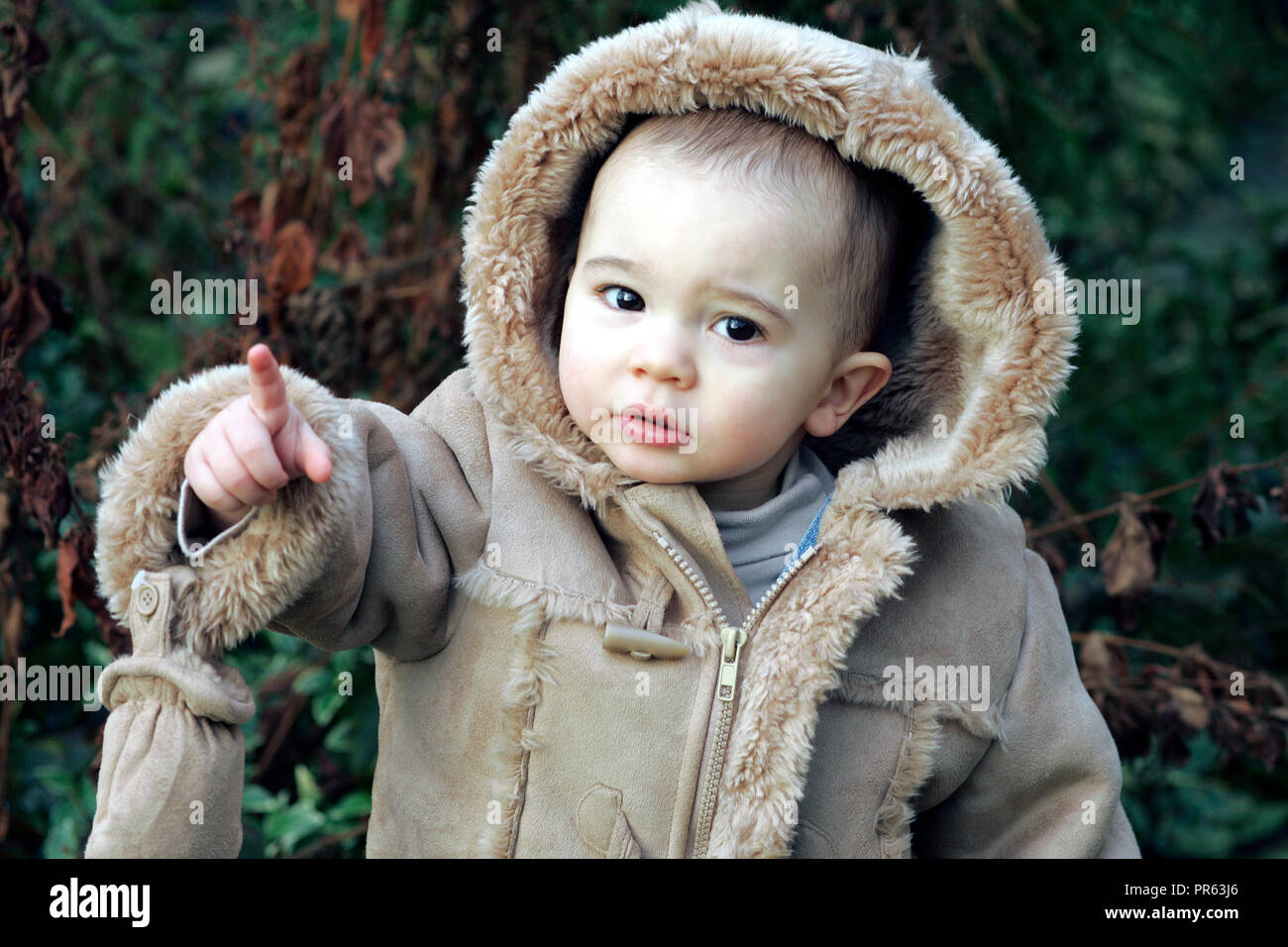 male toddler dressed for cold weather Stock Photo