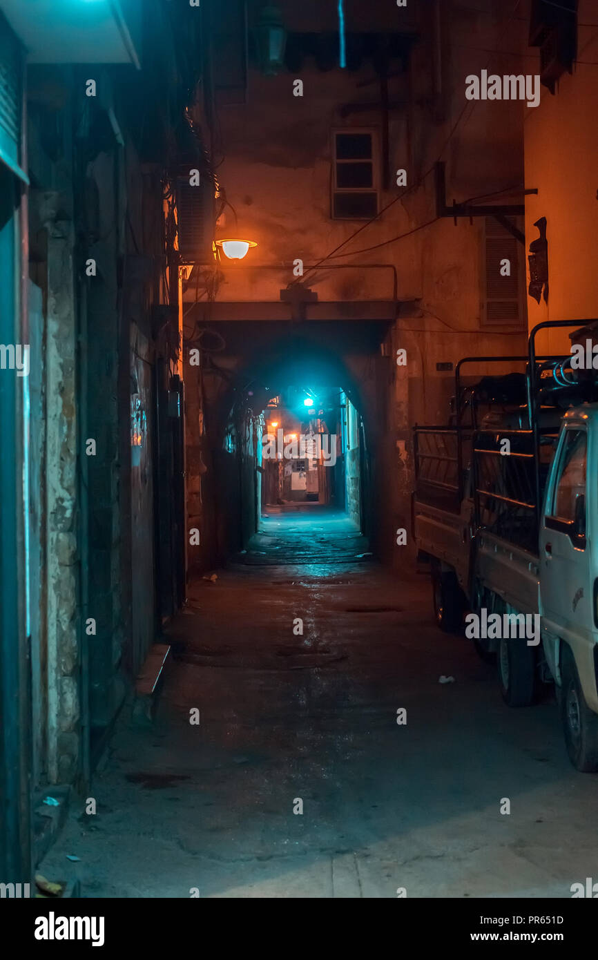 Damascus / Syria night photo of an empty narrow alley in the old city near the Umayyad Mosque in Bab Touma with street lights. Stock Photo