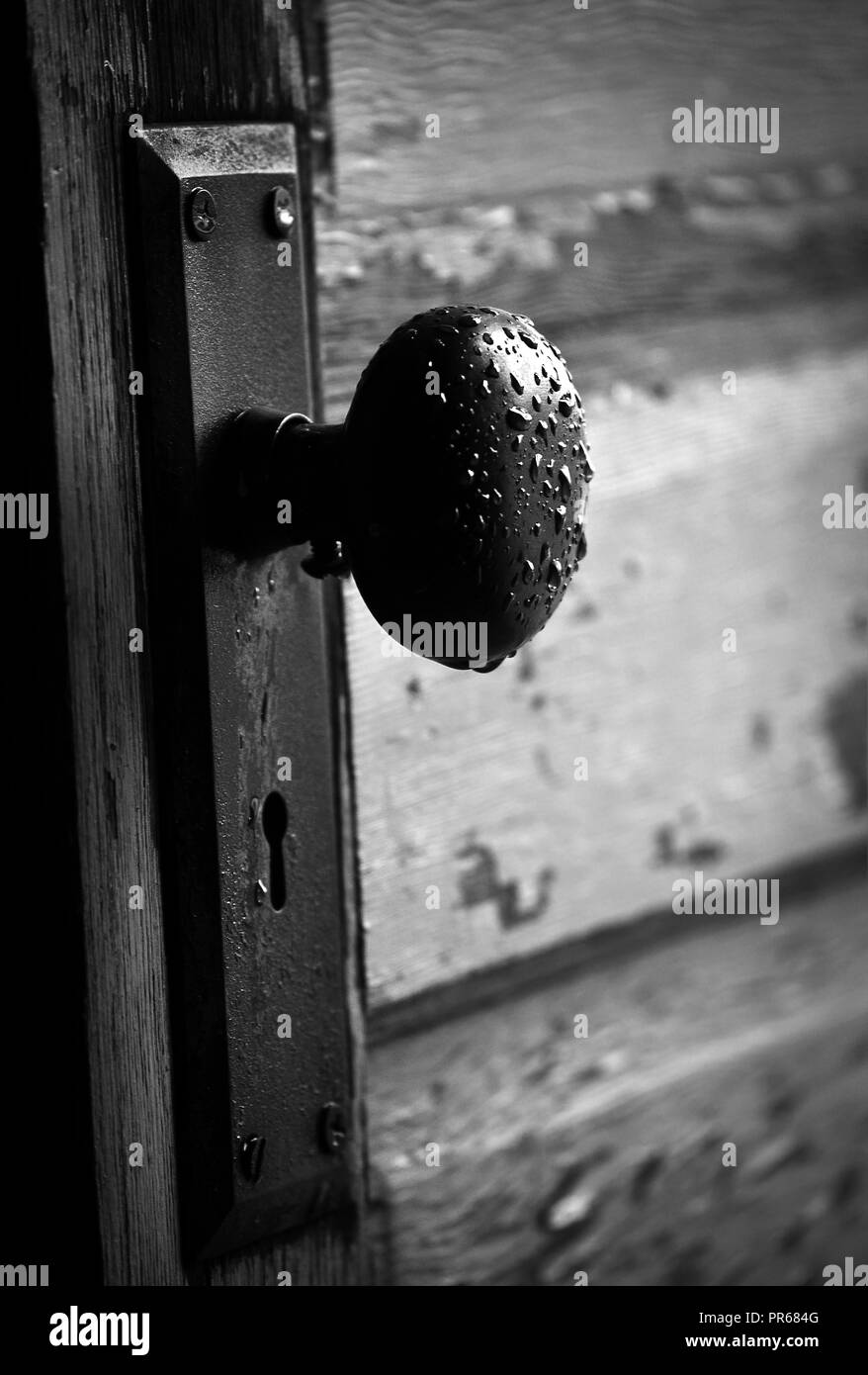 weathered - an old weather garage door handle Stock Photo