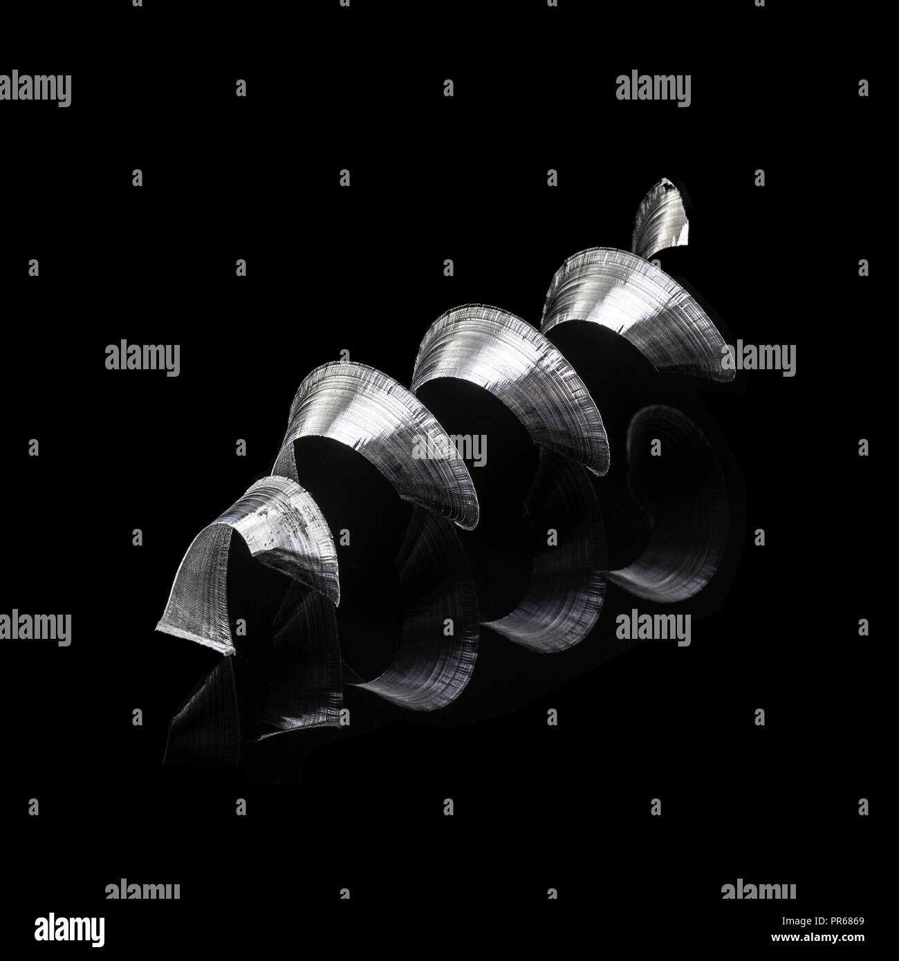 Macro shot of a swarf helix on a black background Stock Photo