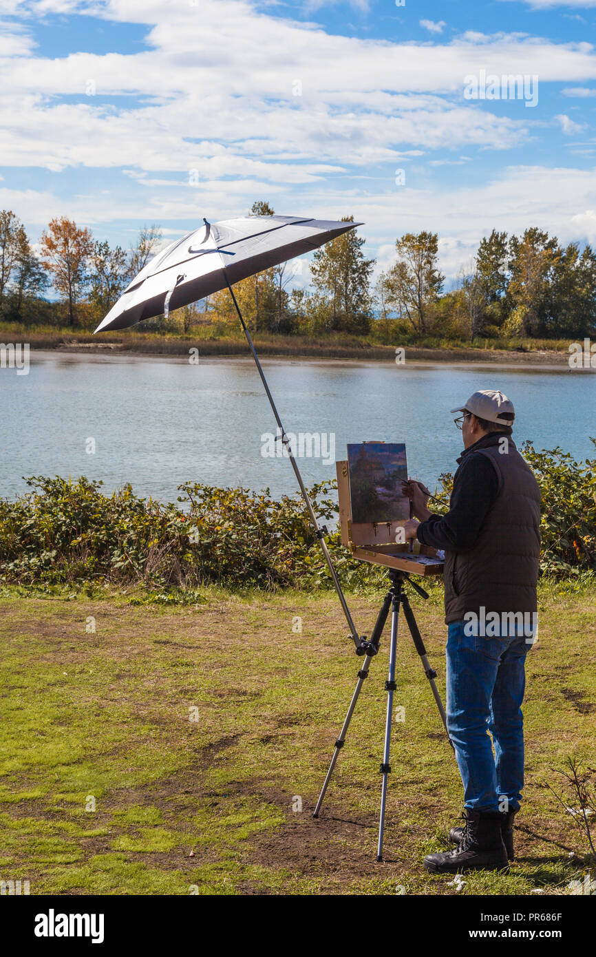 An artist participating in an Art Grand Prix in Steveston, British Columbia Stock Photo