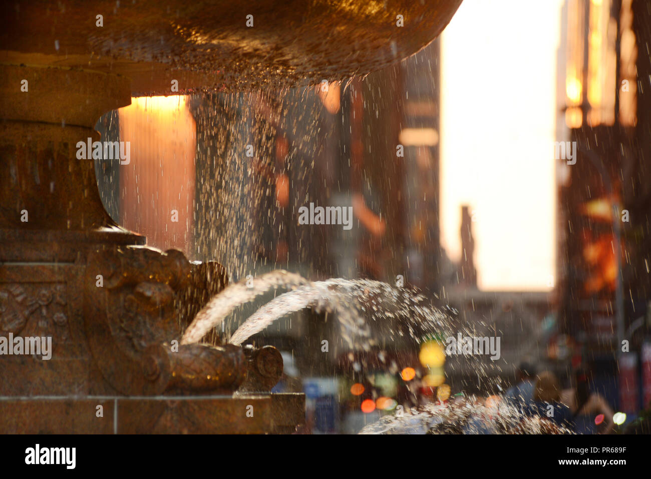 Lights effects on Bryan Park fountain at sunset NYC Manhattan  USA Stock Photo