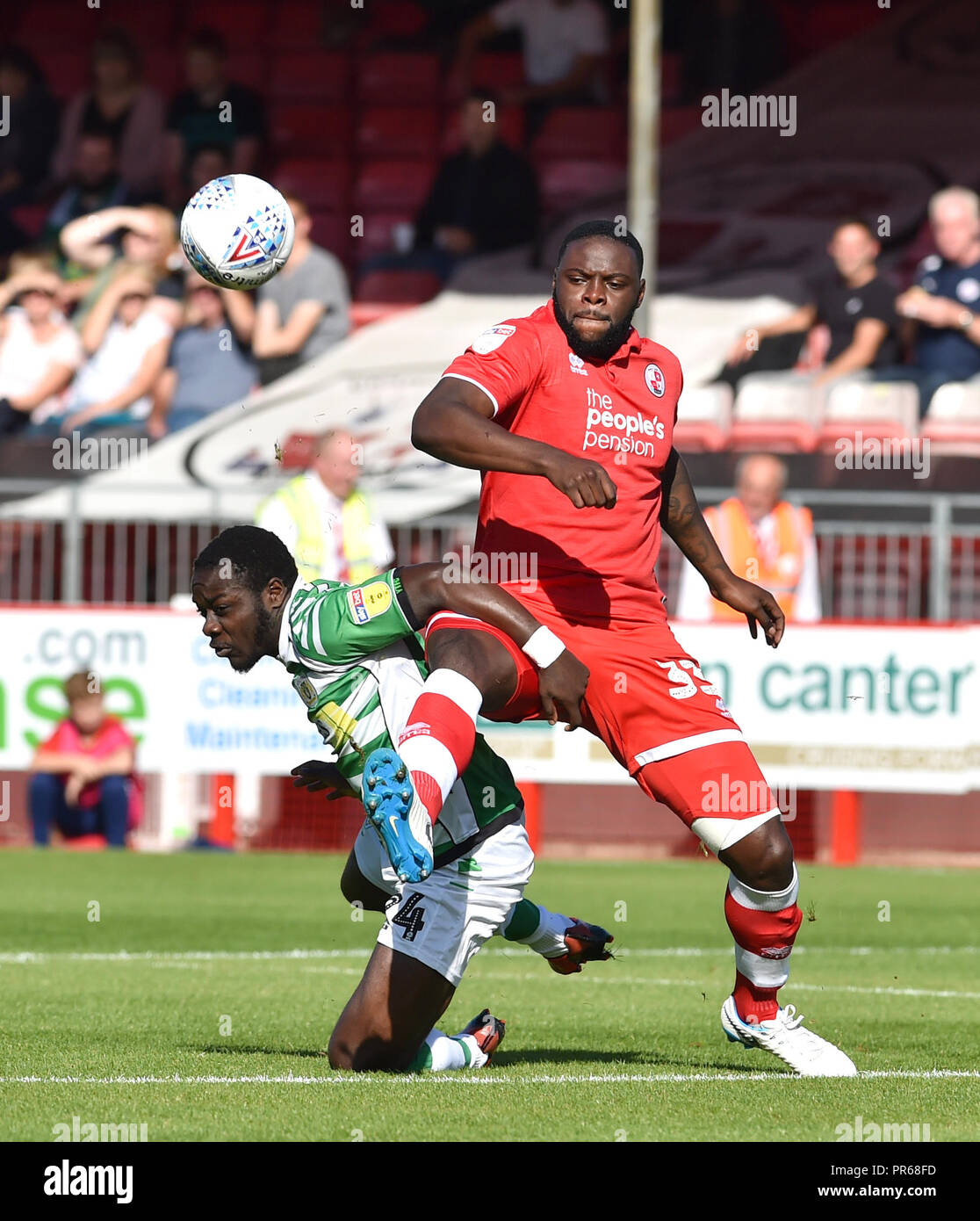 Bondz N'Gala of Crawley puts in a strong challenge on Olufela Olomola of Yeovil during the Sky Bet League 2 match between Crawley Town and Yeovil Town at the Broadfield Stadium , Crawley , 29 Sept 2018 - Editorial use only. No merchandising. For Football images FA and Premier League restrictions apply inc. no internet/mobile usage without FAPL license - for details contact Football Dataco Stock Photo
