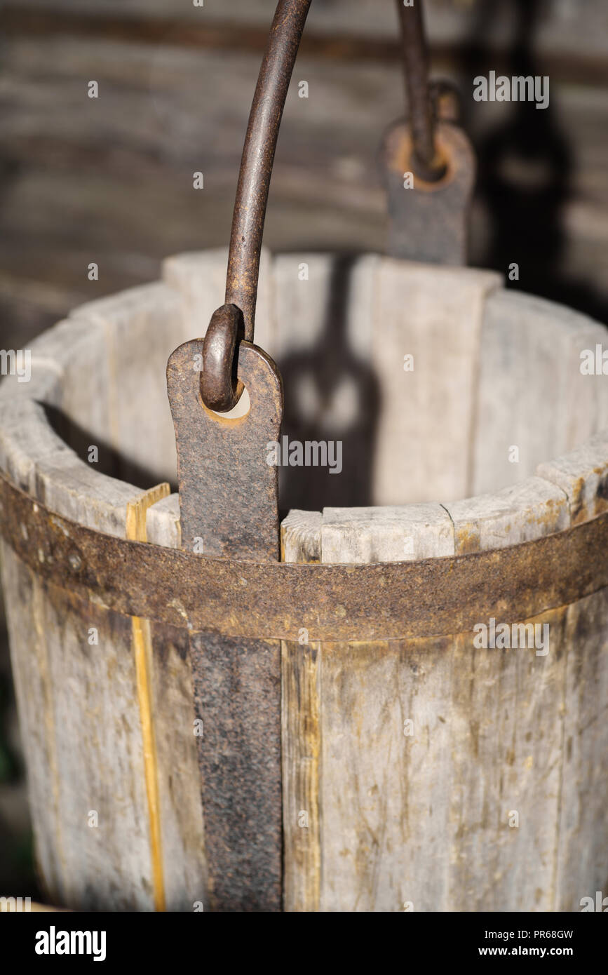 Wooden antique buckets for water with a metal handle Stock Photo Alamy