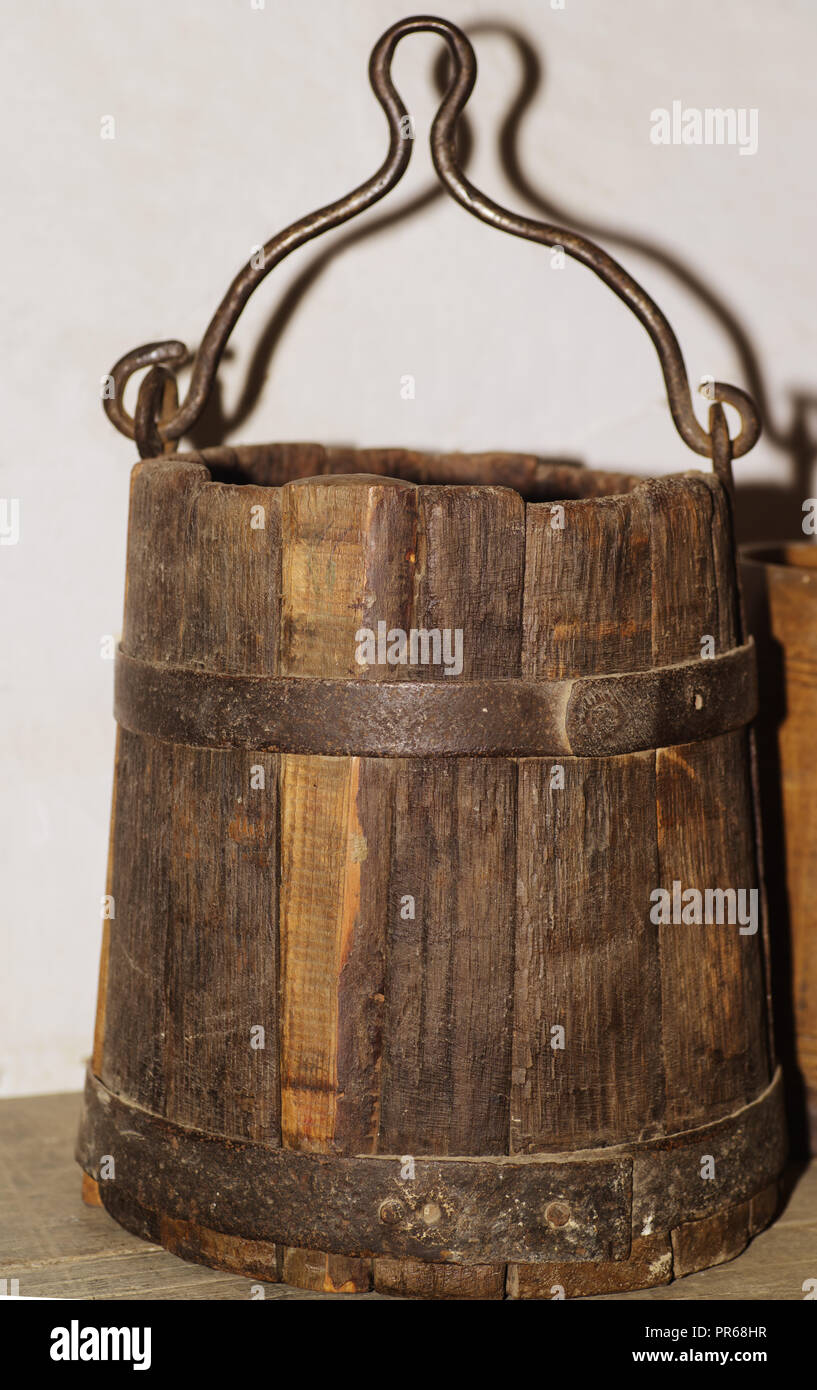 Wooden antique buckets for water with a metal handle Stock Photo Alamy