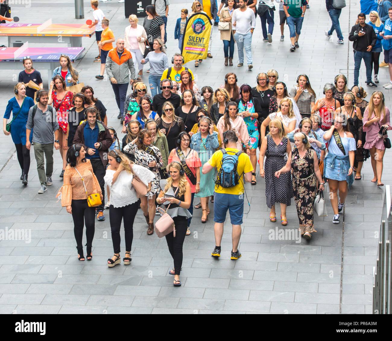 Silent Disco tour inLiverpool.  A group of tourists taking part in a Silent Advenutres Silend Disco Tour. Stock Photo