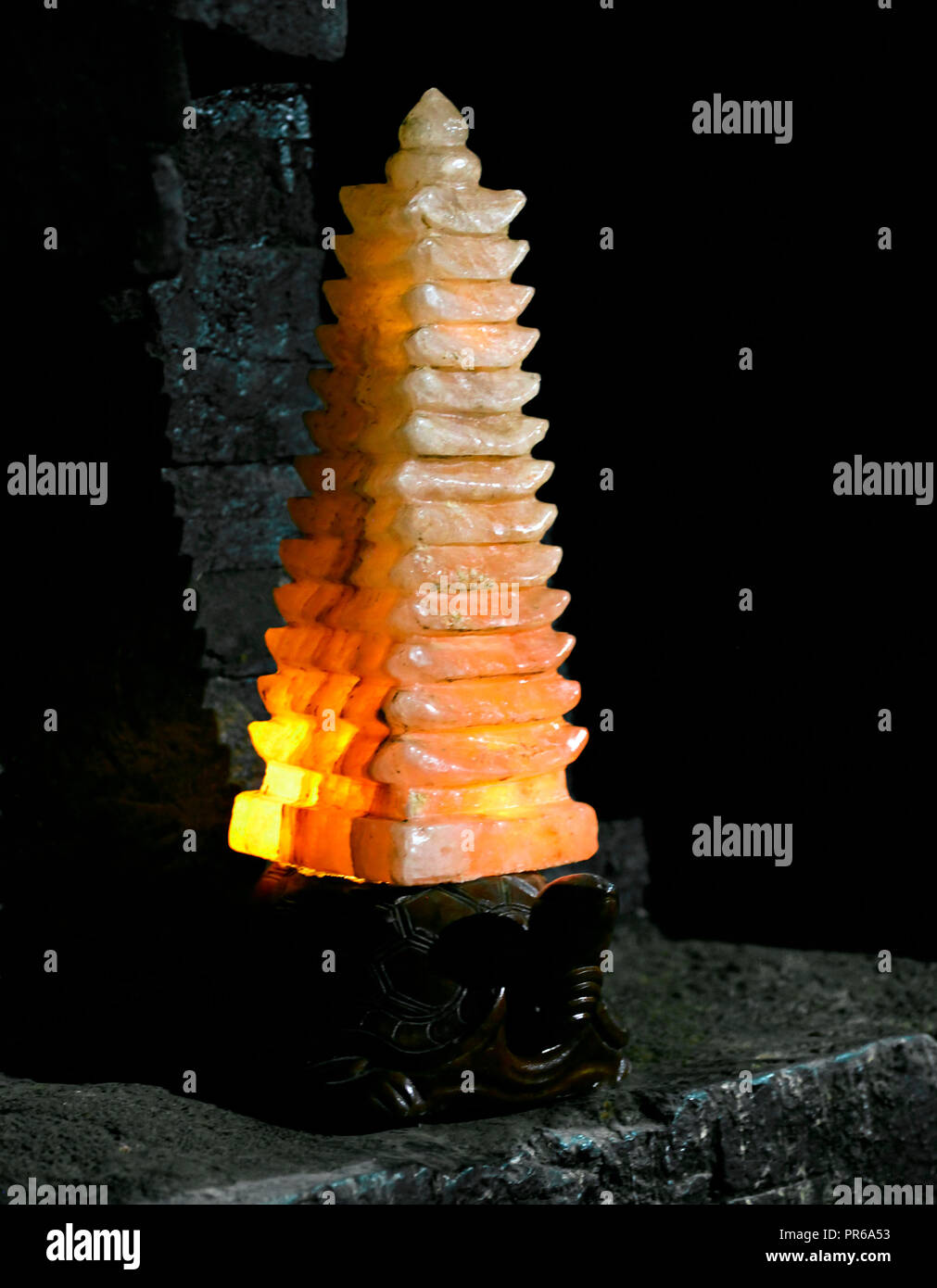Glowing stone lamp in a Buddhist temple Stock Photo