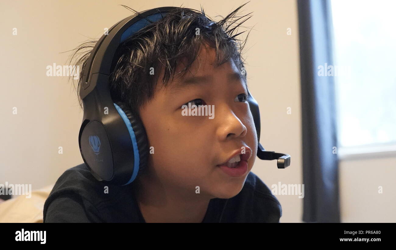 Young gamers using Sony Playstation Stock Photo