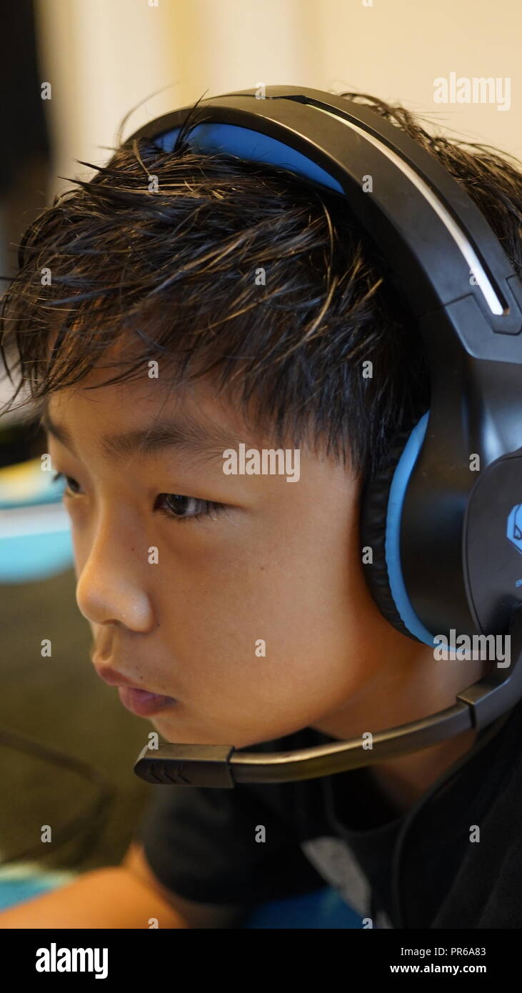 Young gamers using Sony Playstation Stock Photo
