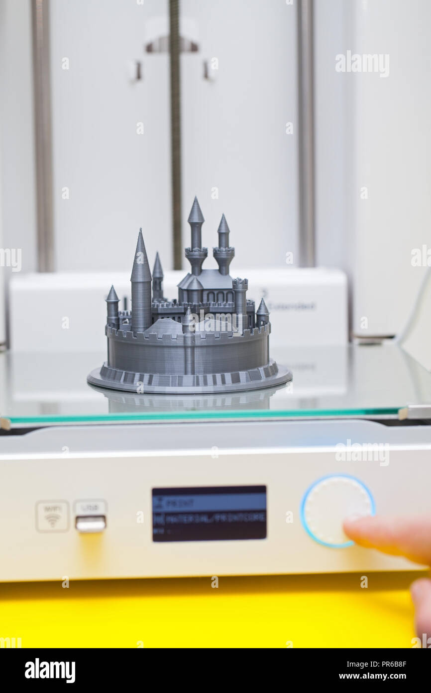 White 3D printer during work. Plastic castle - disney figure almoust done Stock Photo