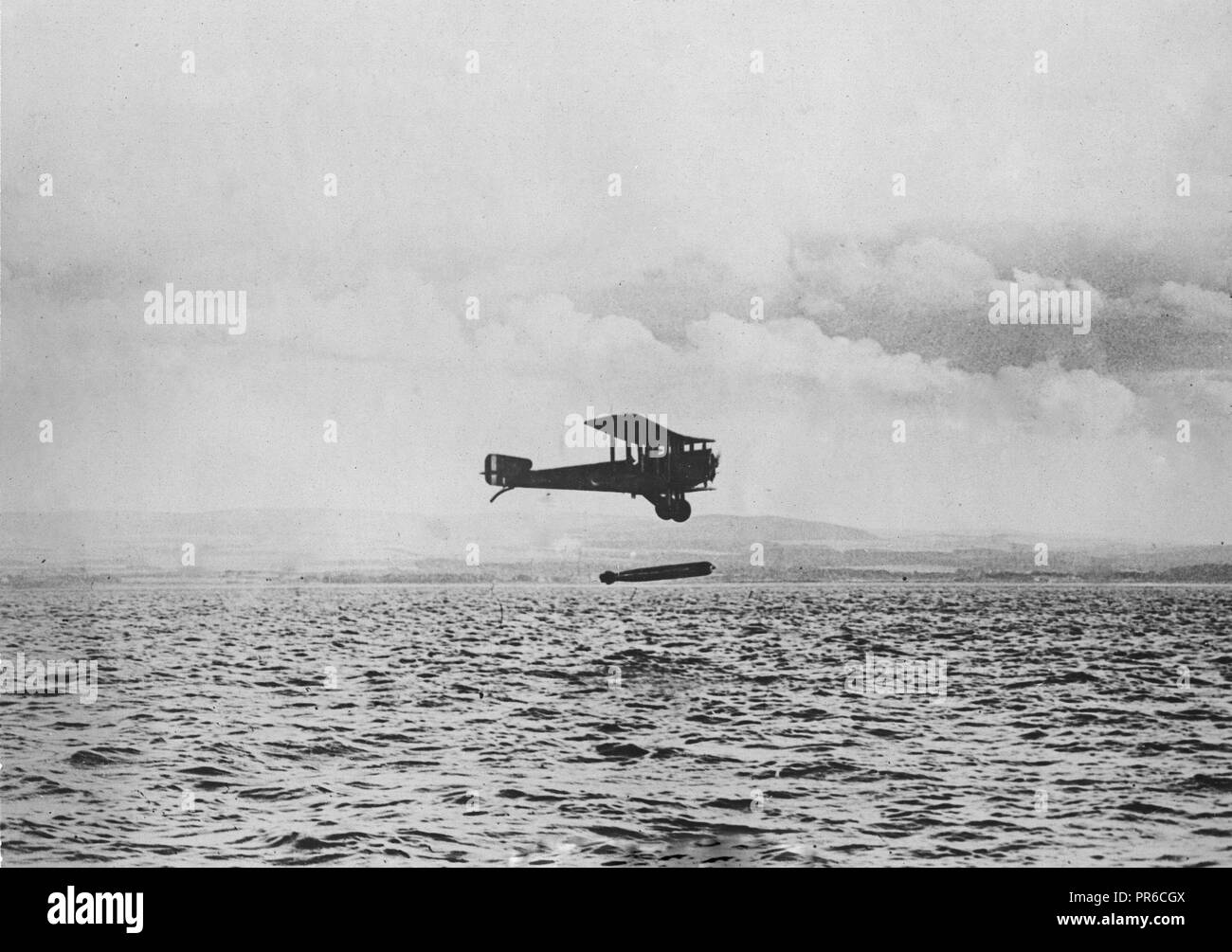 British torpedo carrying airplane. Plane in the act of dropping a bomb- at the time of the cessation of hostilities England had a number of these torpedo carrying aeroplanes completed and ready for use Stock Photo