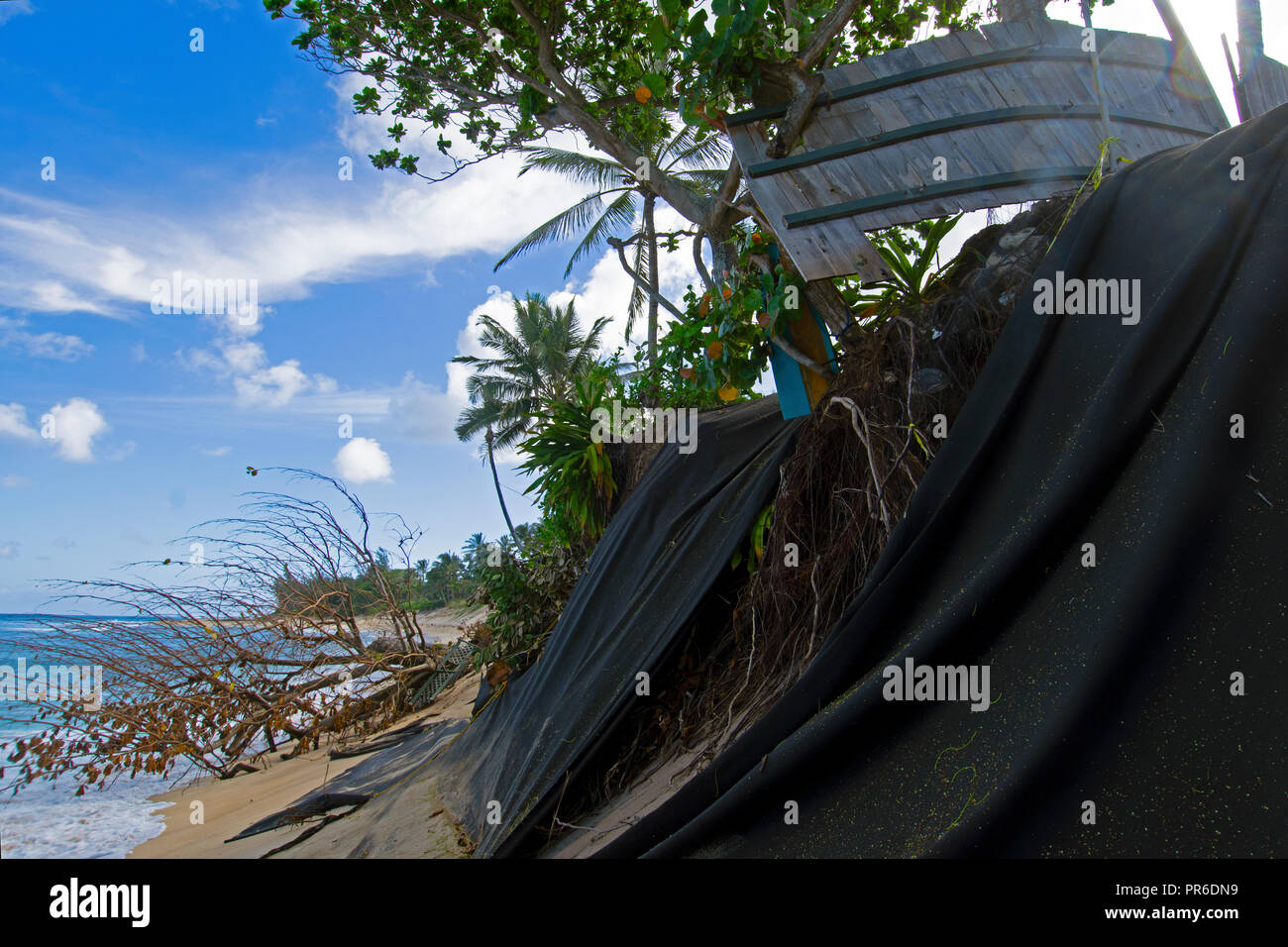 Severe beach erosion in Ehukai Beach or Banzai Pipeline, North Shore of Oahu, Hawaii, USA Stock Photo