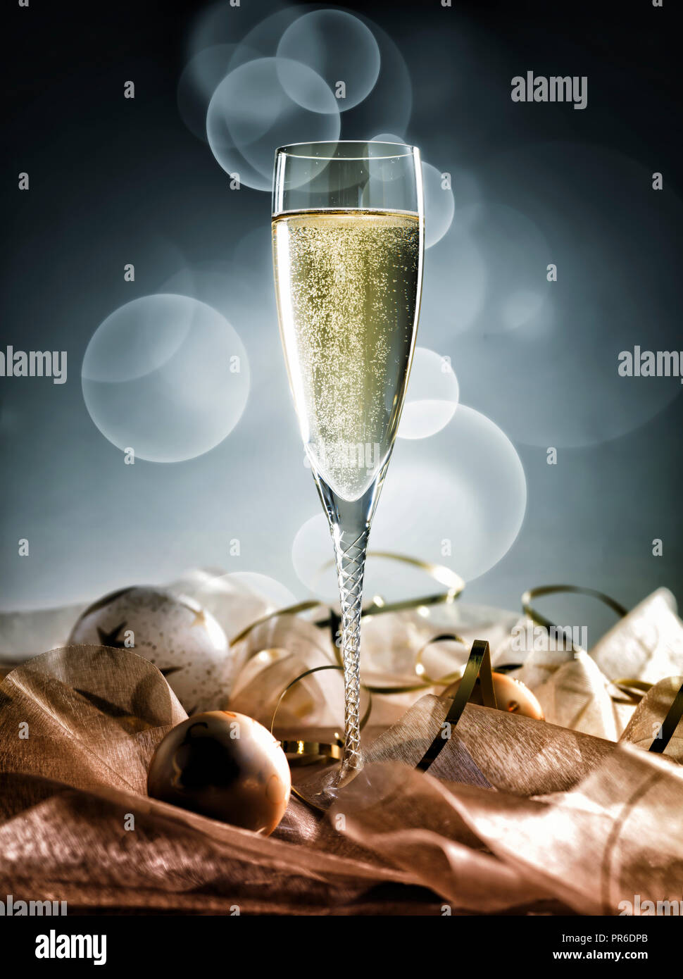 Champagne glass ready to bring in the New Year decoration on golden and ...