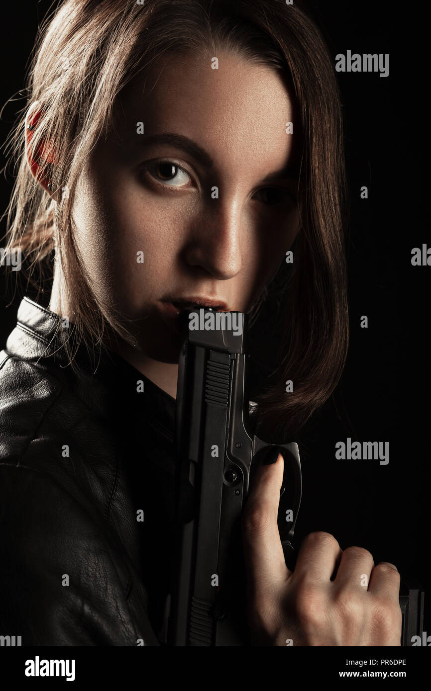 girl holding gun photography