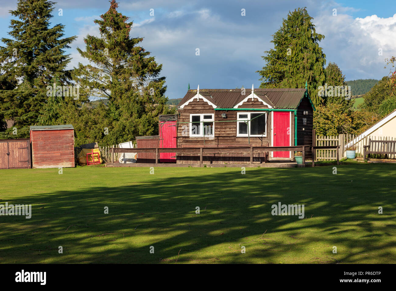 Clun village Bowling Club with wooden club house, on the outskirts of the pretty village, Clun, Shropshire, UK Stock Photo