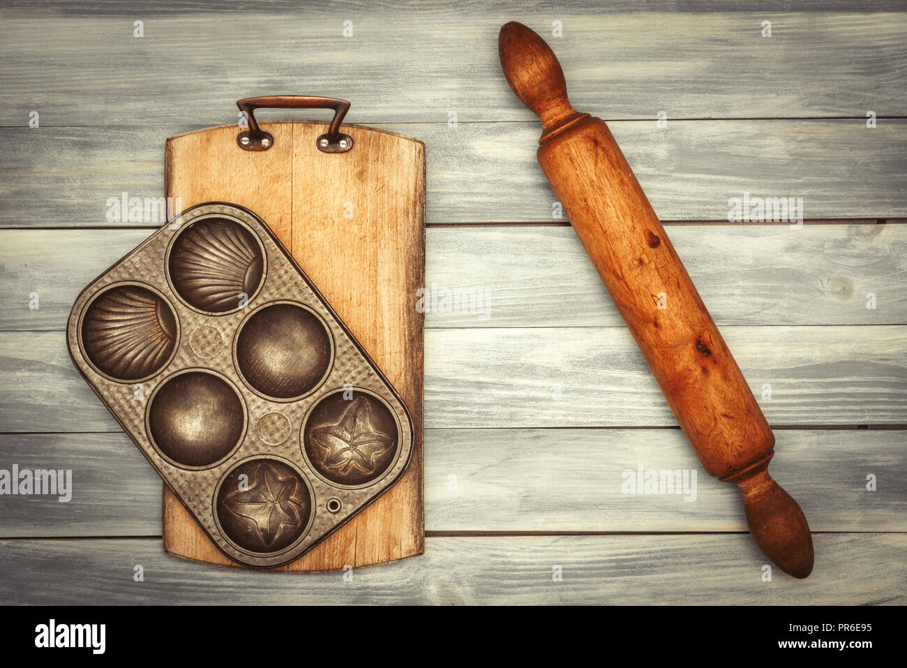 Baking utensils including rustic board, baking tin and rolling pin
