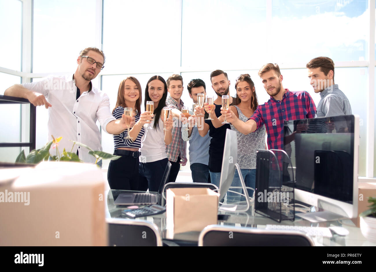 smiling business team standing in new office Stock Photo - Alamy