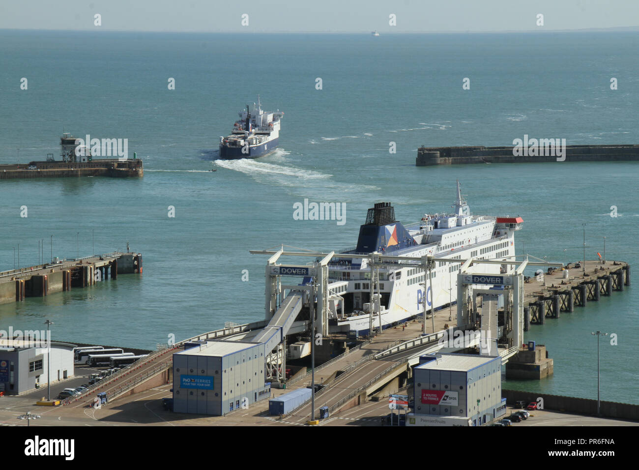 Dover, Kent, UK - September  30 2018: A ferry sails out of the port of Dover bound for Calais, France. The coastal town of Dover and the medieval Dover Castle overlooks the town from the iconic White Cliffs. . Credit: David Mbiyu Stock Photo