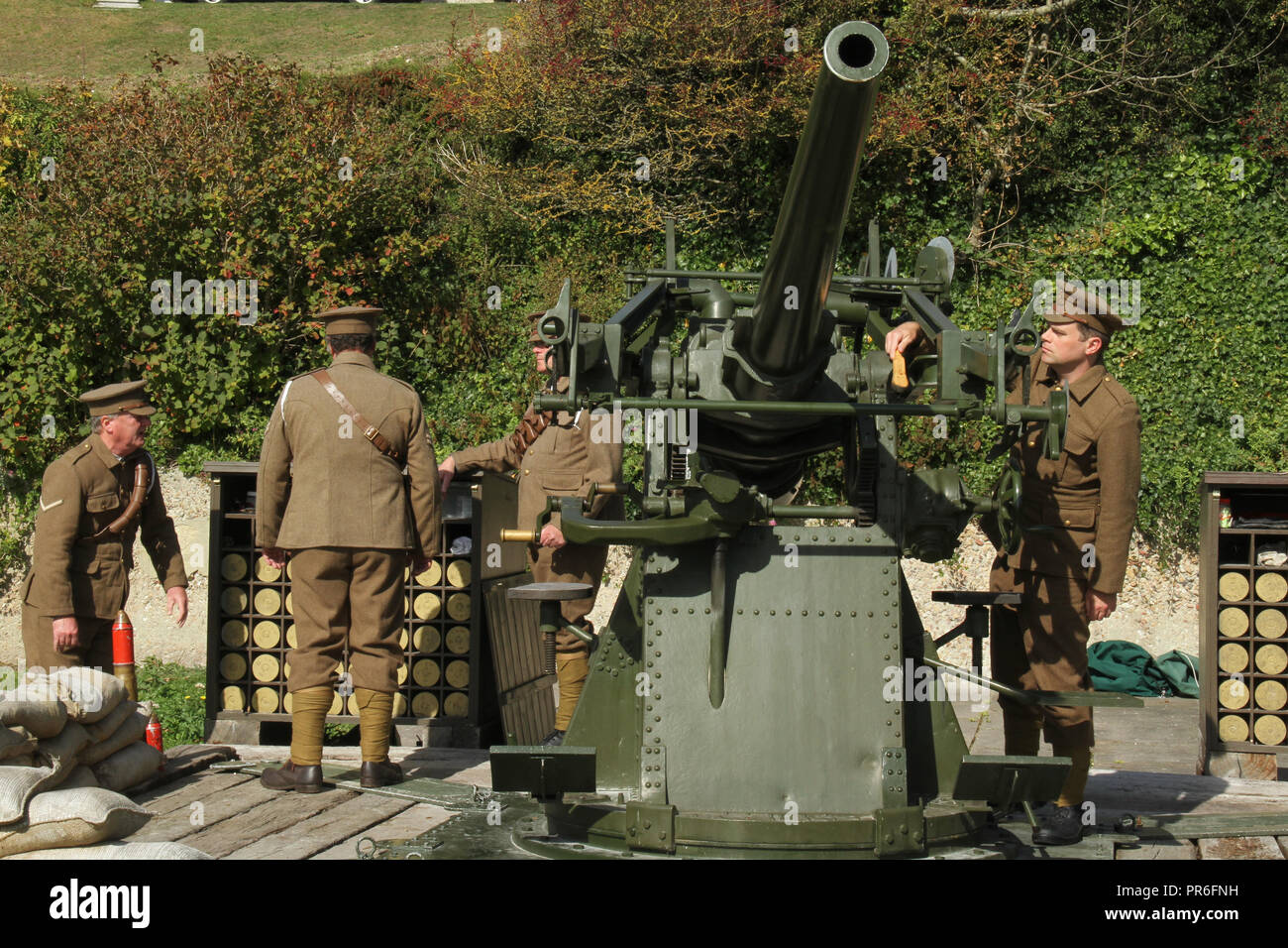 Dover Castle, Kent, UK - September  30 2018:  Guides prepare a 3inch 20cwt AA gun ahead of a   firing demonstrate of the military defence used in 1914 fro the White Cliffs of Dover.. Dover in Kent is a major port for ferries to Calais, France. Credit: David Mbiyuedieval Dover Castle overlooks the town from the iconic White Cliffs. Dover in Kent is a major port for ferries to Calais, France. Credit: David Mbiyu Stock Photo