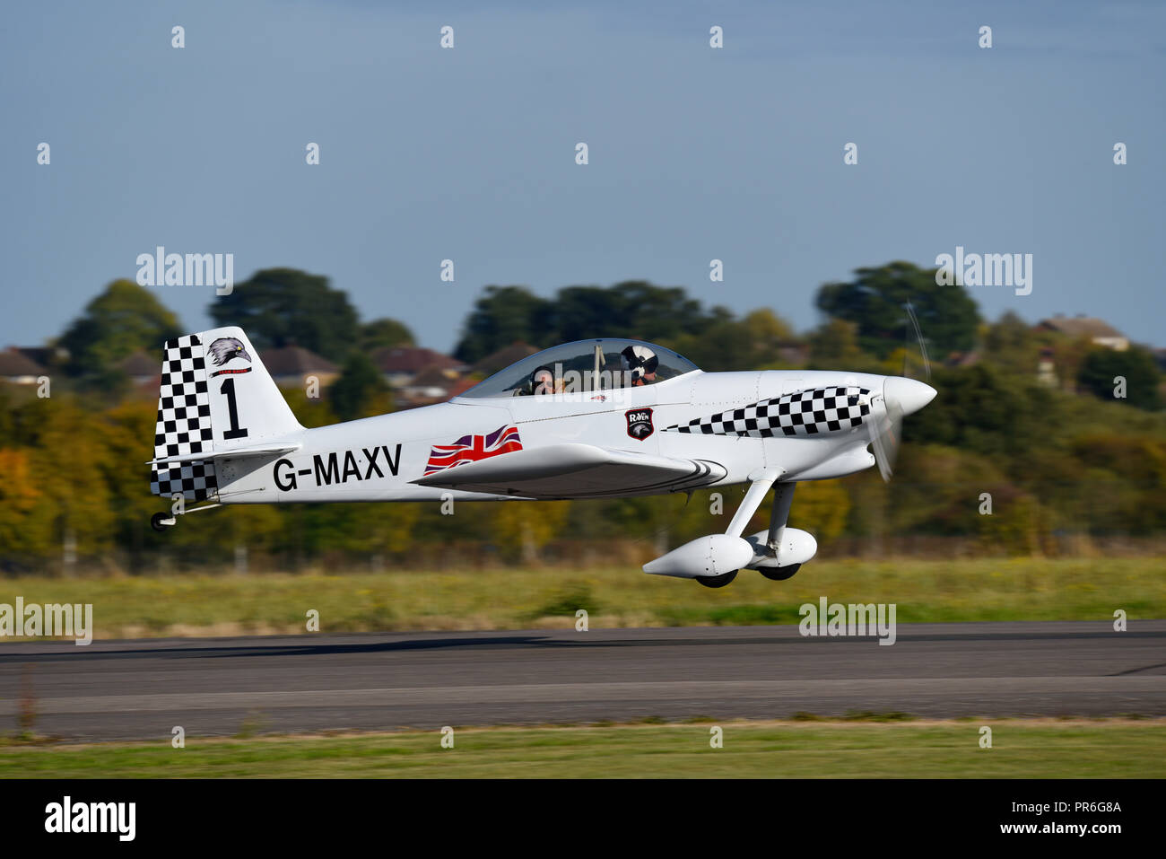 Jenkinson Vans RV-4 homebuilt plane taking off at North Weald Airfield, Essex, UK, with British Union Jack flag. Part of the Raven 8s aerobatic team Stock Photo