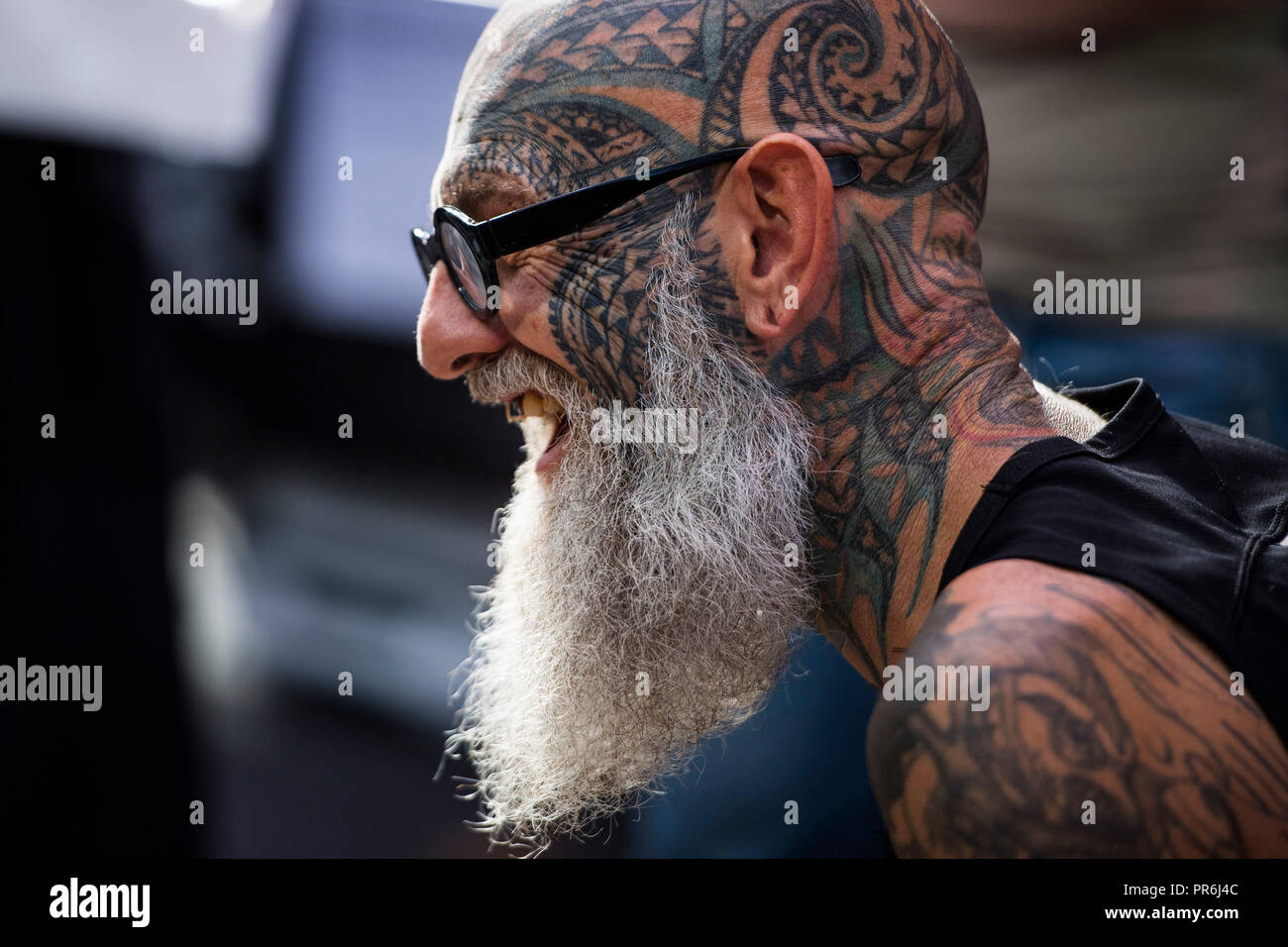 A man show off his tattoos during the International tattoo convention at Tobacco Dock in east London. Stock Photo