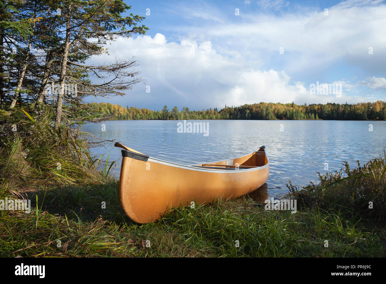 Canoe on the shore of a beautiful northern Minnesota lake during autumn Stock Photo Alamy