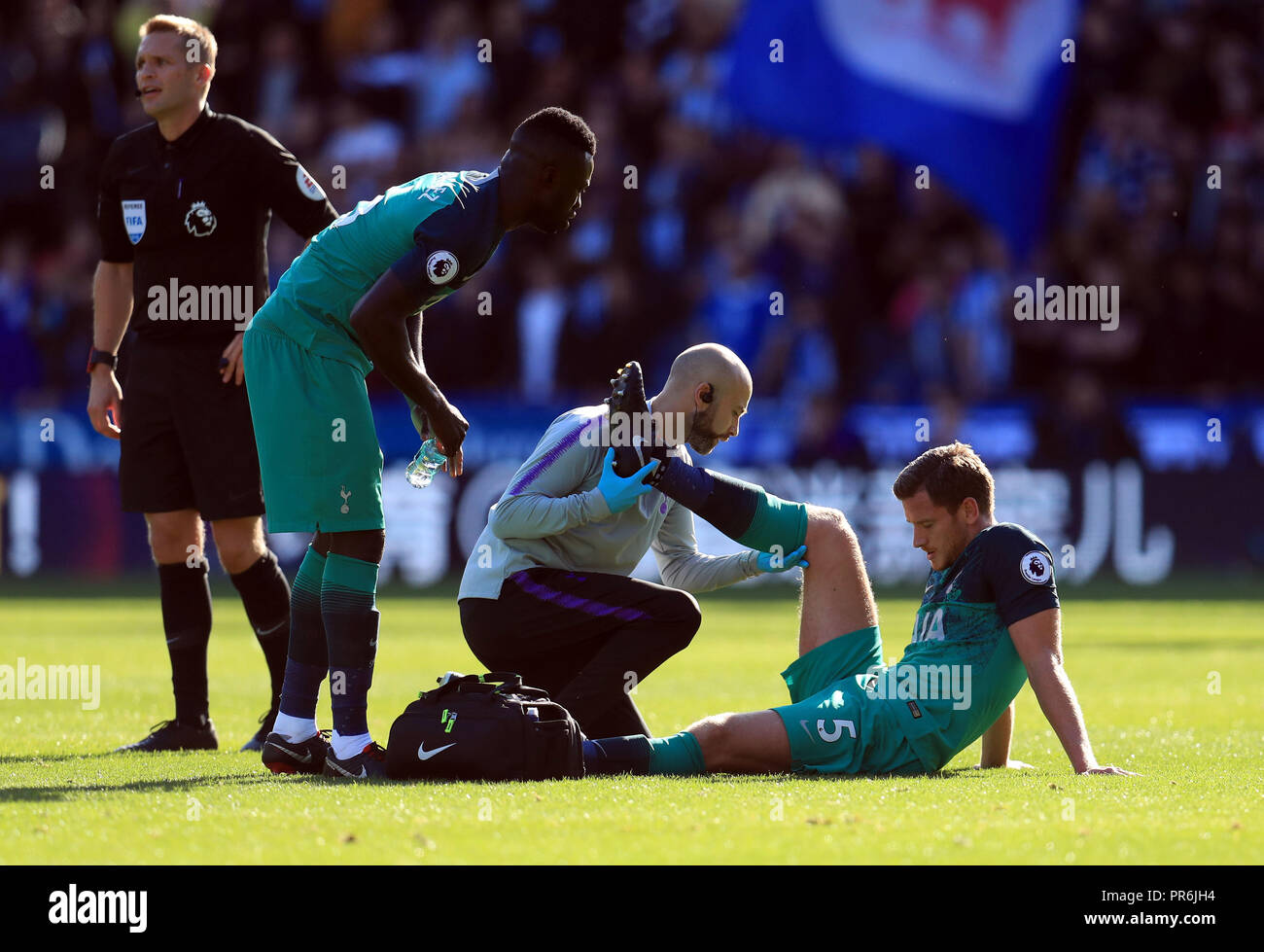 Tottenham Hotspur's Jan Vertonghen receives treatment for an injury during the Premier League match at the John Smith's Stadium, Huddersfield Stock Photo