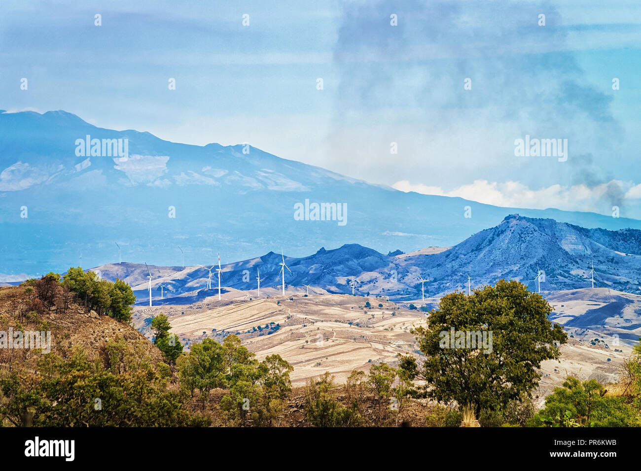 Landscape of valley with fires at fields in Morgantina, Enna province, Sicily, Italy Stock Photo