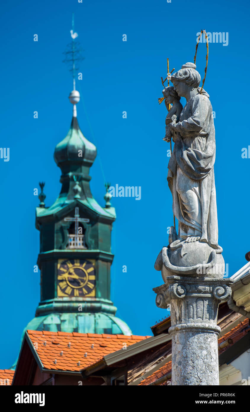 Bell tower and Marian column. Stock Photo