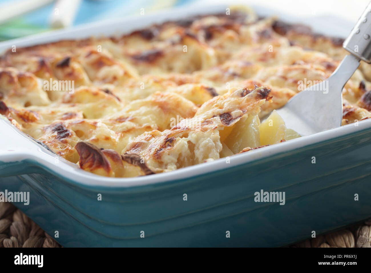 Kohlrabi and potato gratin in a baking dish Stock Photo